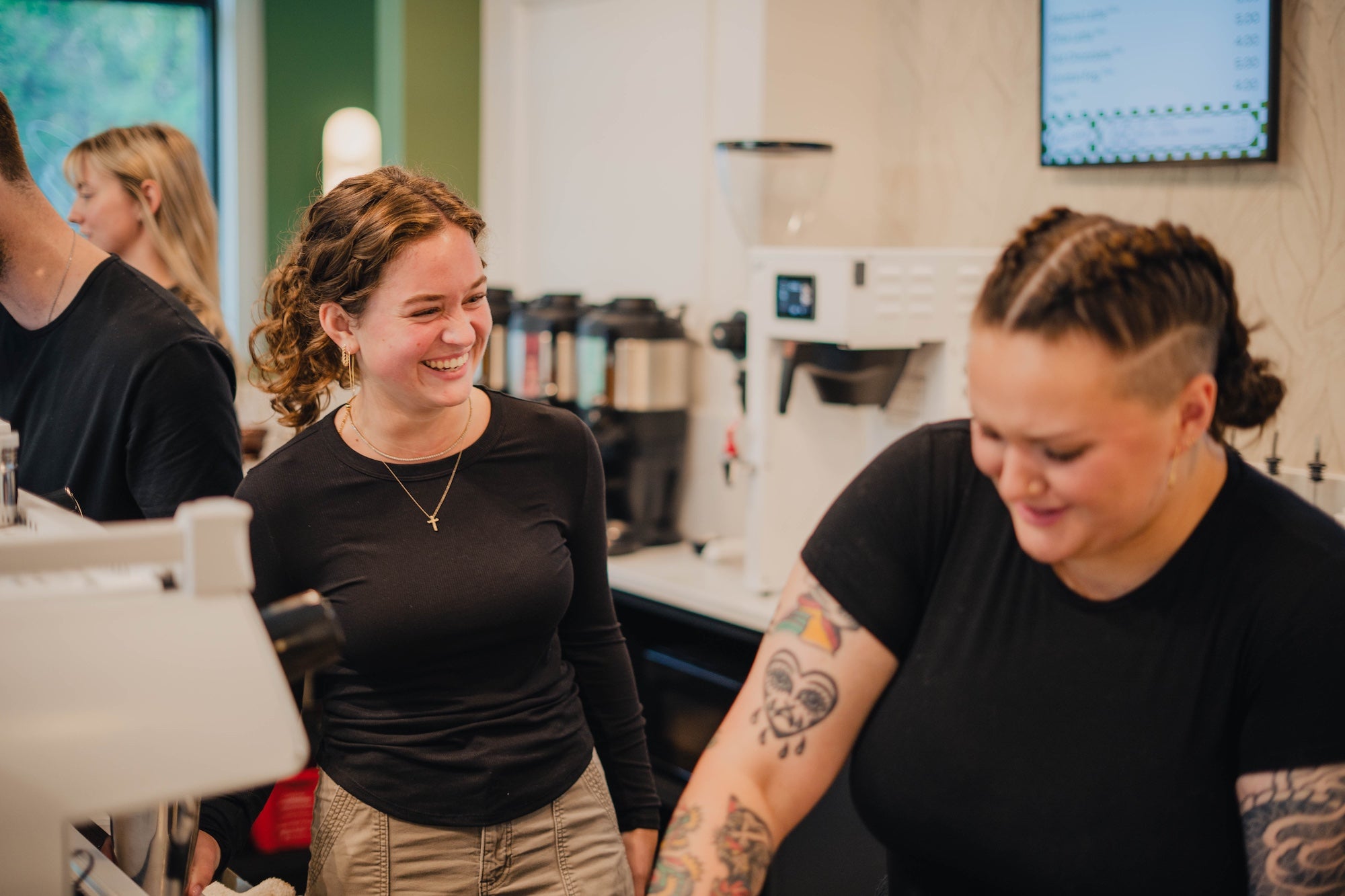 baristas smiling at Origin Coffee Bar, Hilton Head Island, South Carolina | Specialty Coffee Roaster and Cafe